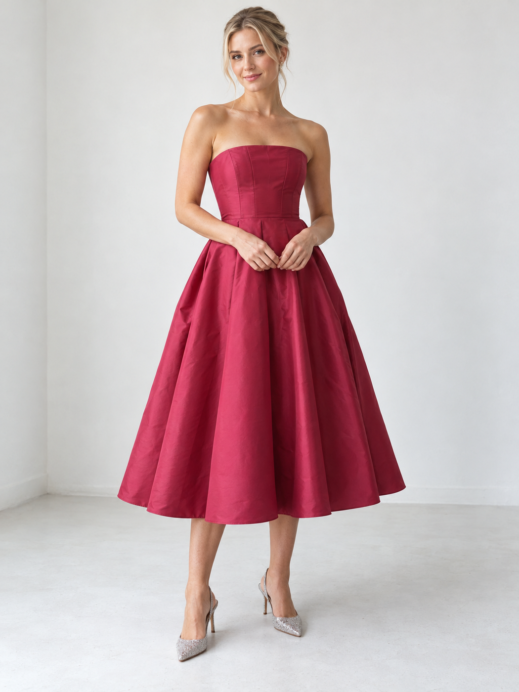 Raspberry strapless midi dress with a full skirt and silver glitter heels