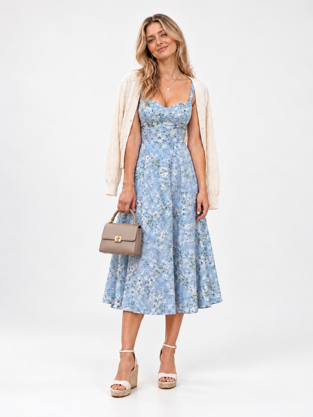 Blue floral midi sundress with an ivory cardigan and cream wedge sandals